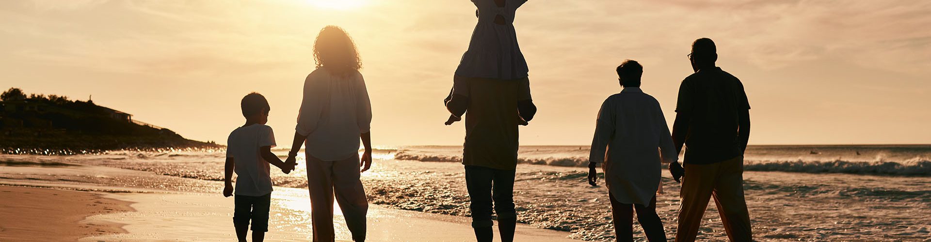 Silhouette, family is walking on beach and back view with ocean waves, sunset and bonding in nature.